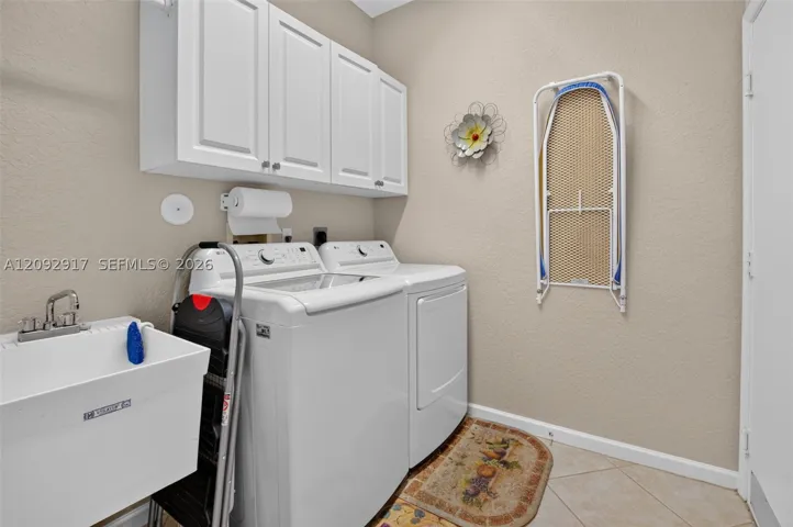 Laundry room with utility sink.