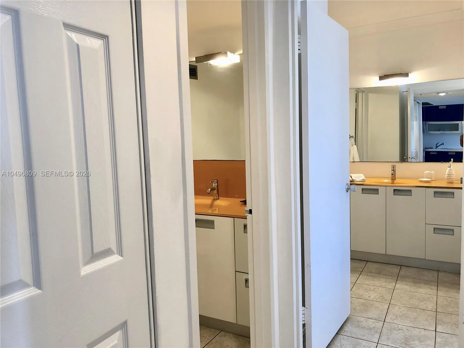 Hallway to 1 and 1/2 bathrooms