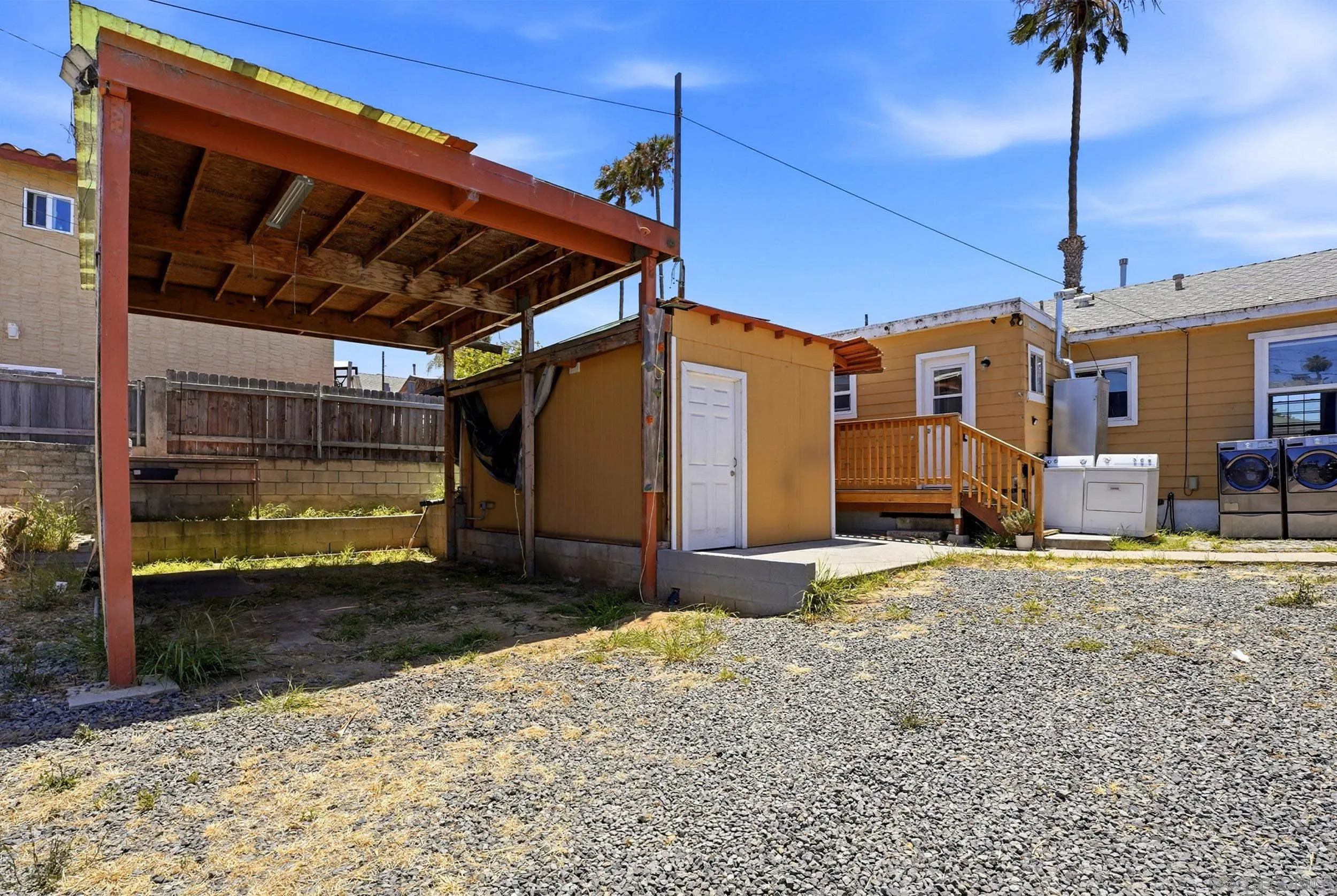 Large lot with RV Carport parking for possible rental oportunity (water, sewer, & electricty connected) Parking for 8 cars. and storage shed.