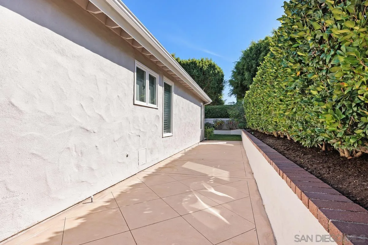 Every large and well-maintained side-yard. Add your own potted plants with the irrigation hook-ups along the side for your own enjoyment!