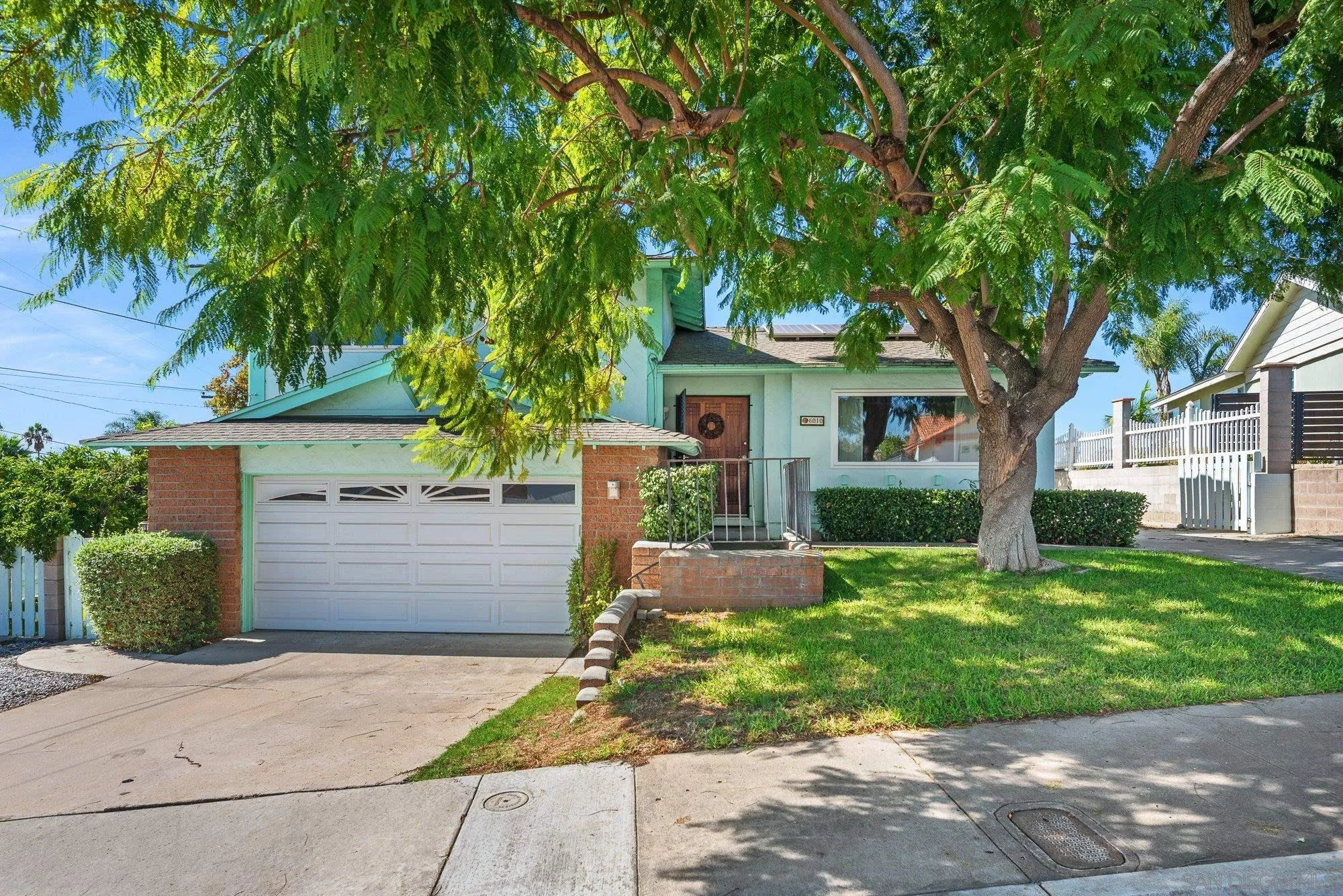 6010 Chadwick Ave, San Diego, CA 92139 Nice sized front yard with RV gated parking to the right.