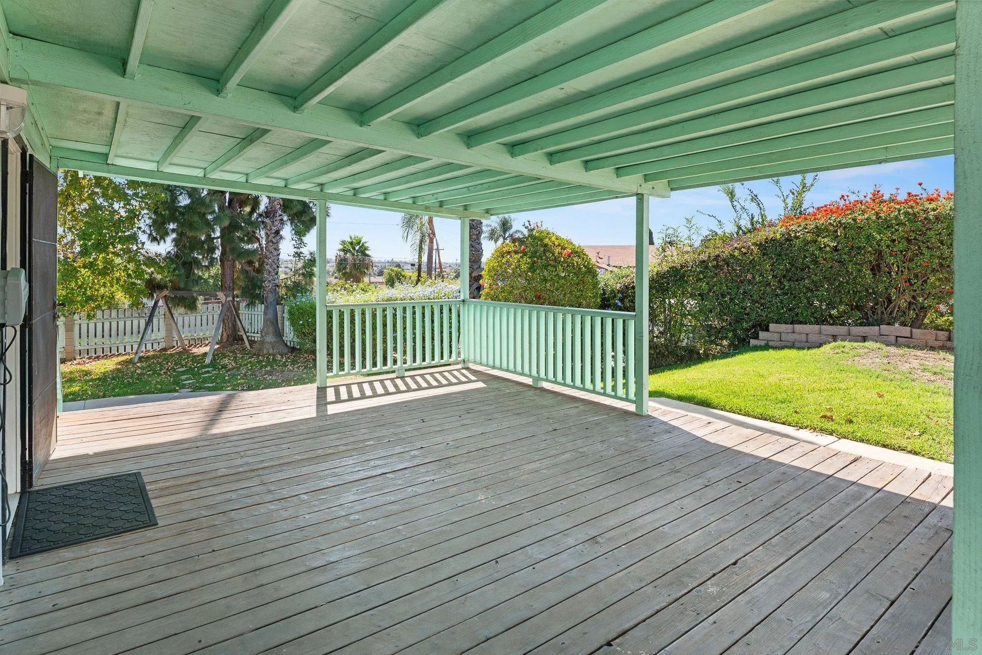 6010 Chadwick Ave, San Diego, CA 92139 Large covered deck off of family room. Easy access to the kitchen for entertaining.
