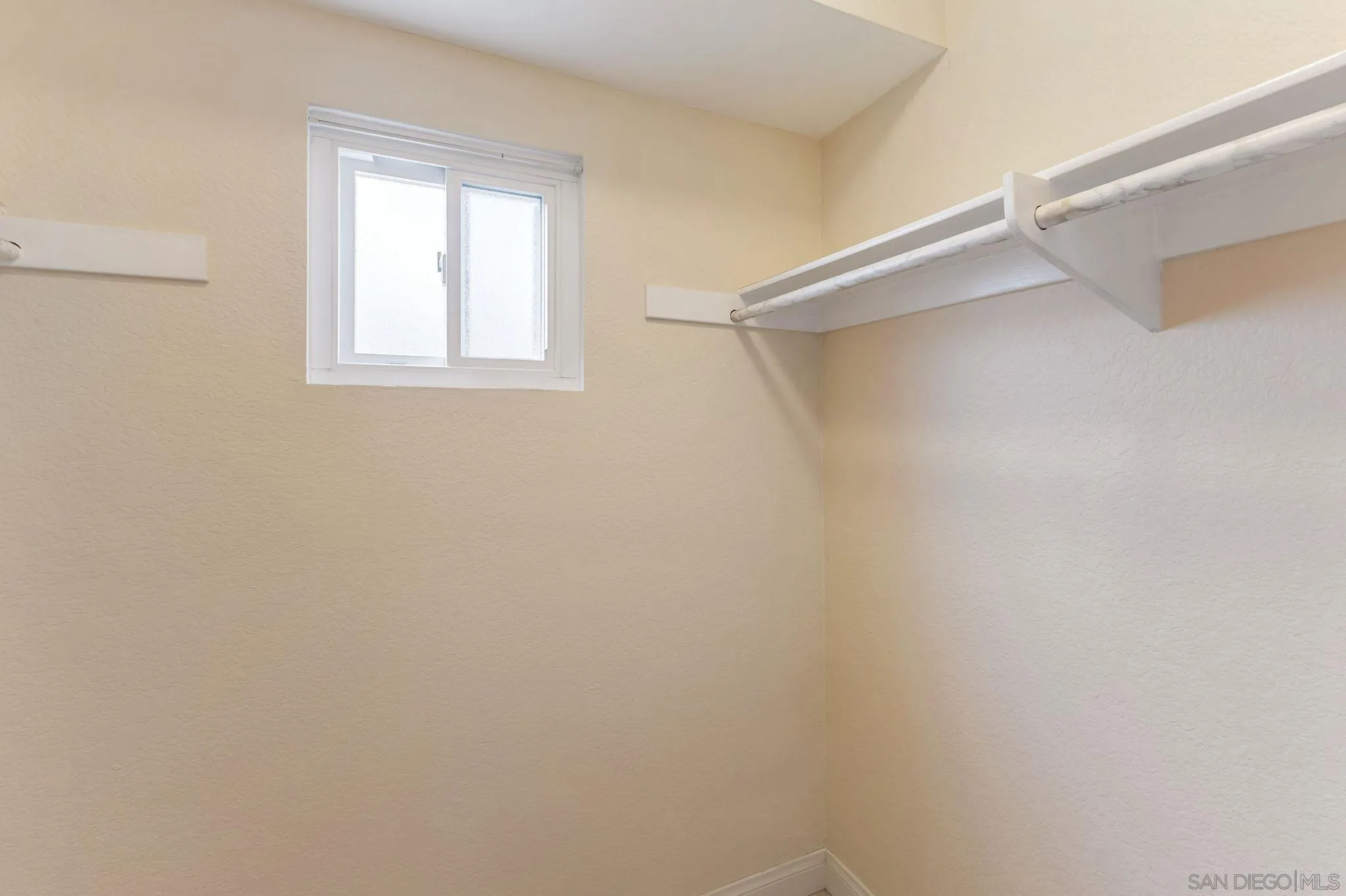 6161 Calle Mariselda, #409, San Diego, CA 92124 Primary suite has a walk-in closet with a window!