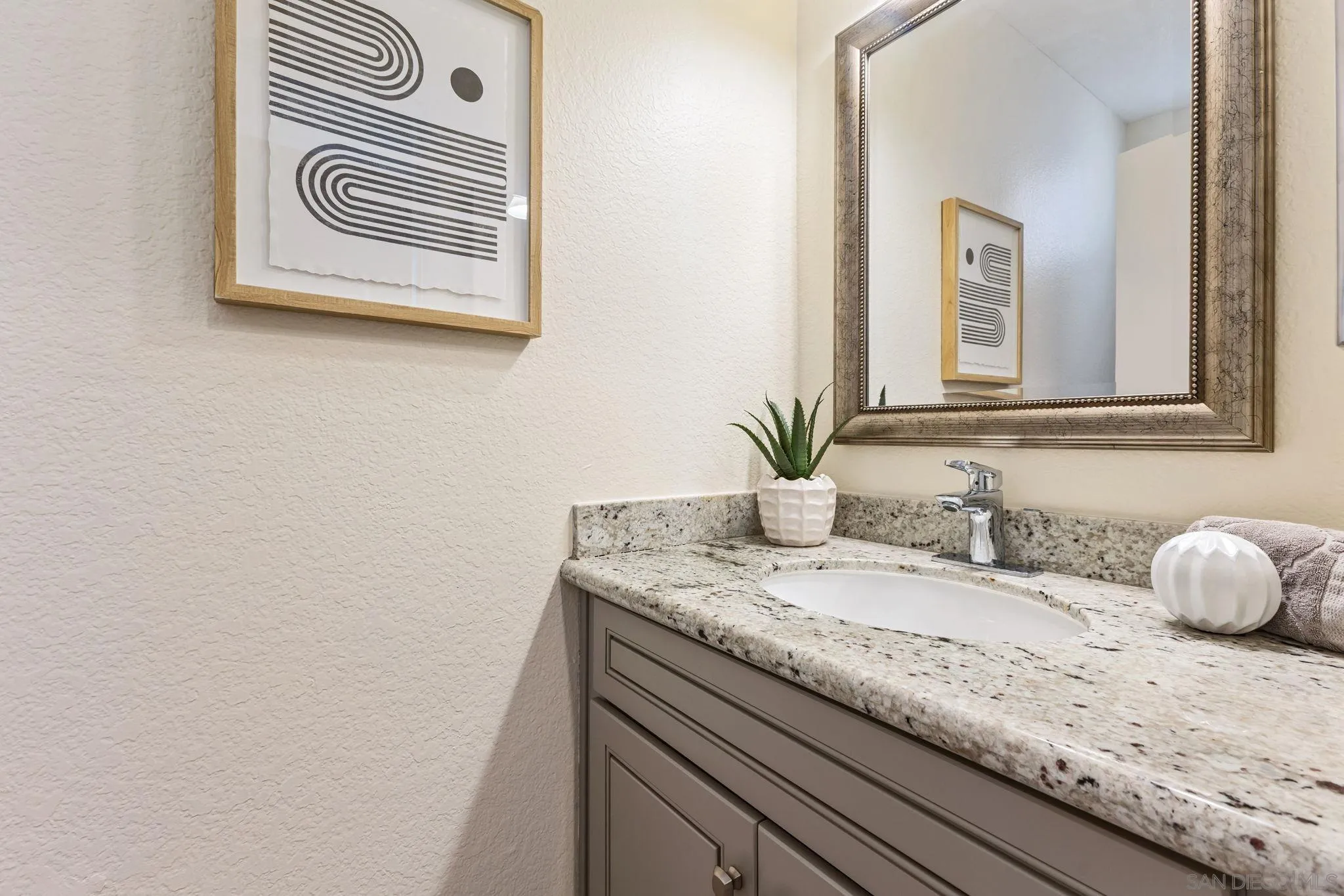 6161 Calle Mariselda, #409, San Diego, CA 92124 Half bathroom on same level as kitchen and living area