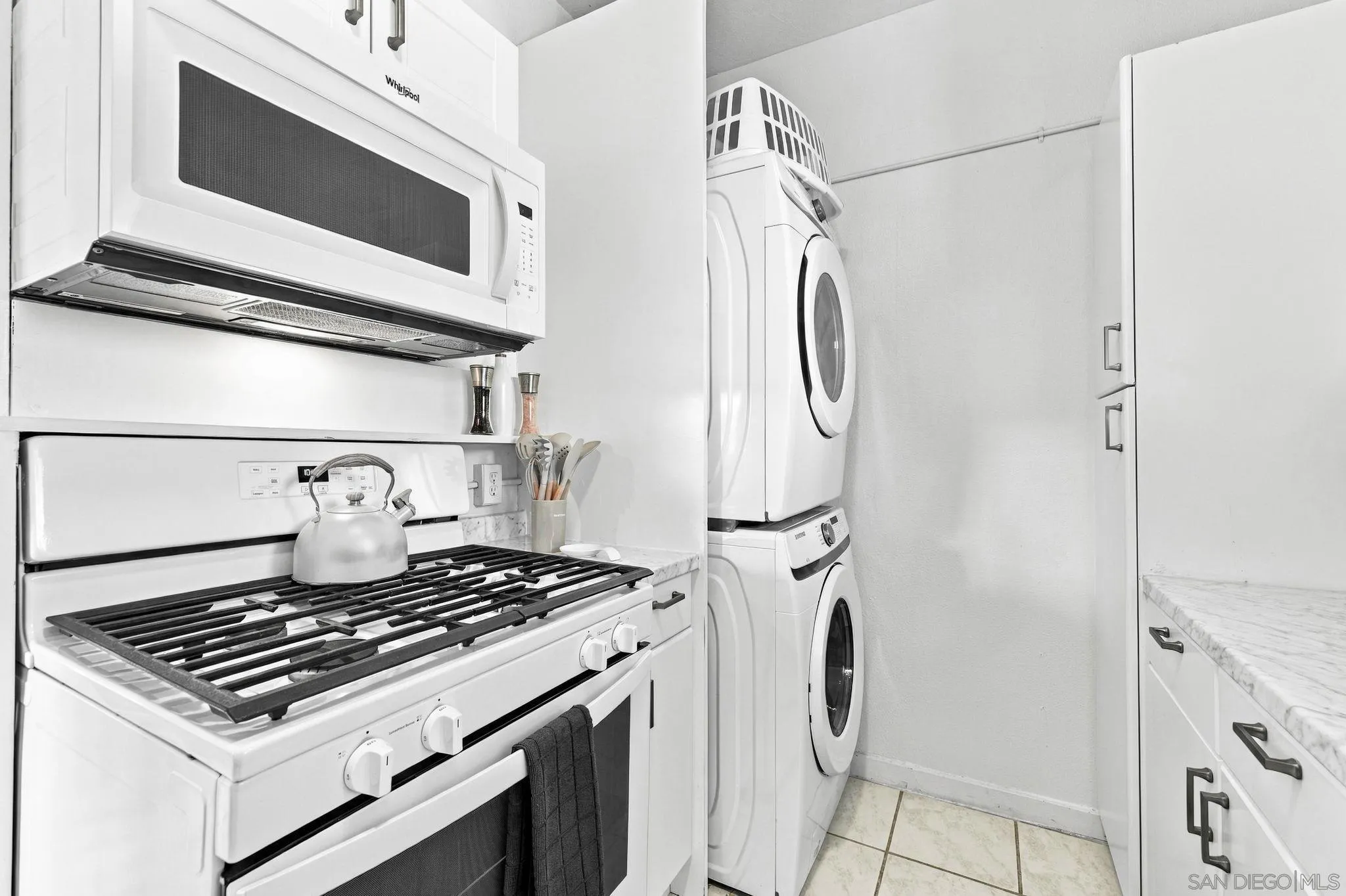 7444-7446 Draper Ave, La Jolla, CA 92037 Stacked laundry in kitchen