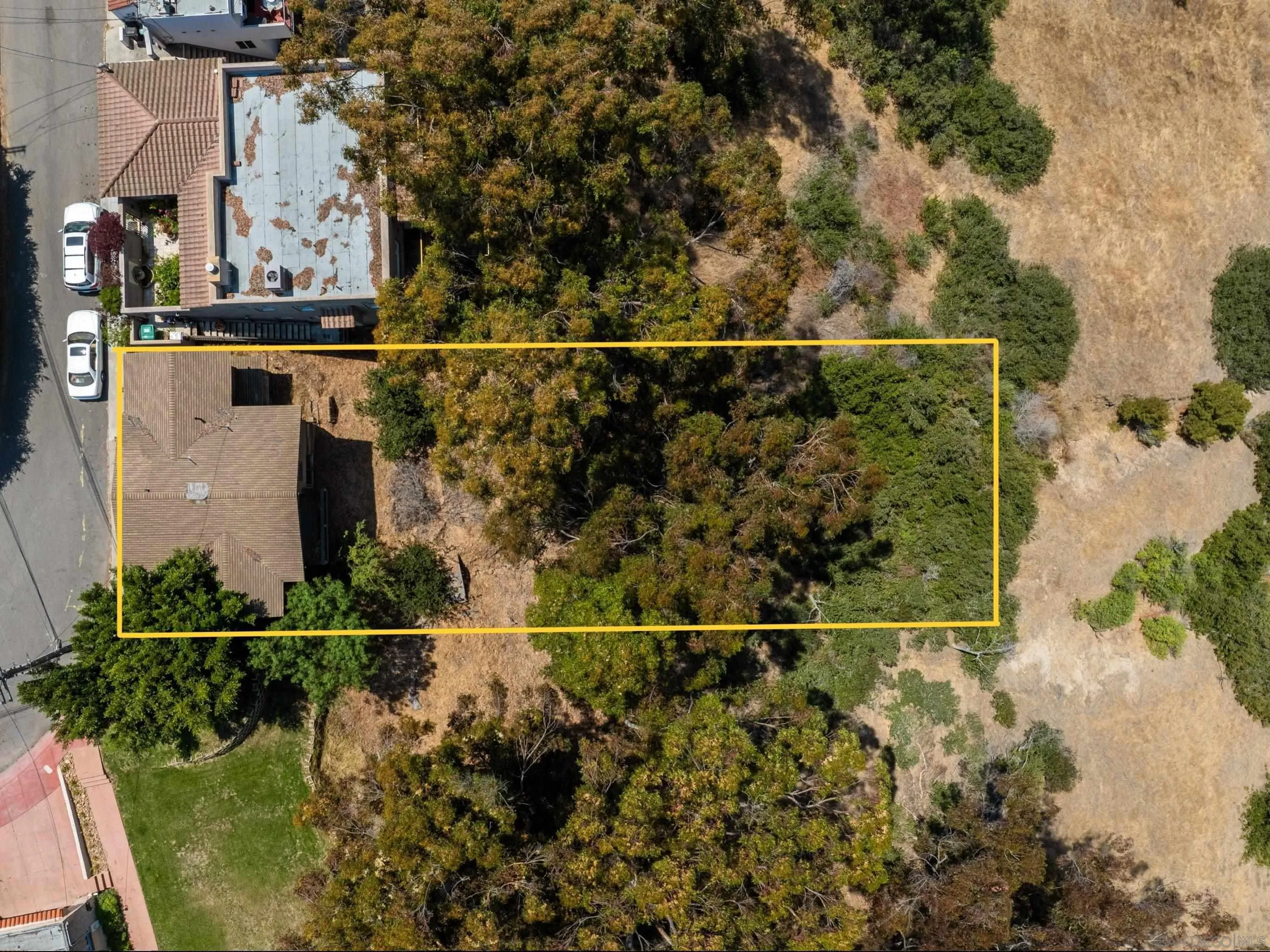 Perched on canyon rim in a prime location, this Craftsman bungalow awaits transformation and offers a unique opportunity for those seeking to design their dream home in Mission Hills. Generous lot (9975sf) with mature trees and sloping terrain affords numerous possibilities for a visionary buyer wanting to restore or recreate. Residence is not habitable in its current state, so only cash offers will be considered.