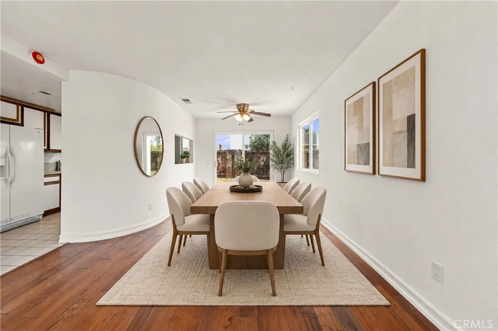 Dining area digitally enhanced w virtual staging of furniture and accessories.