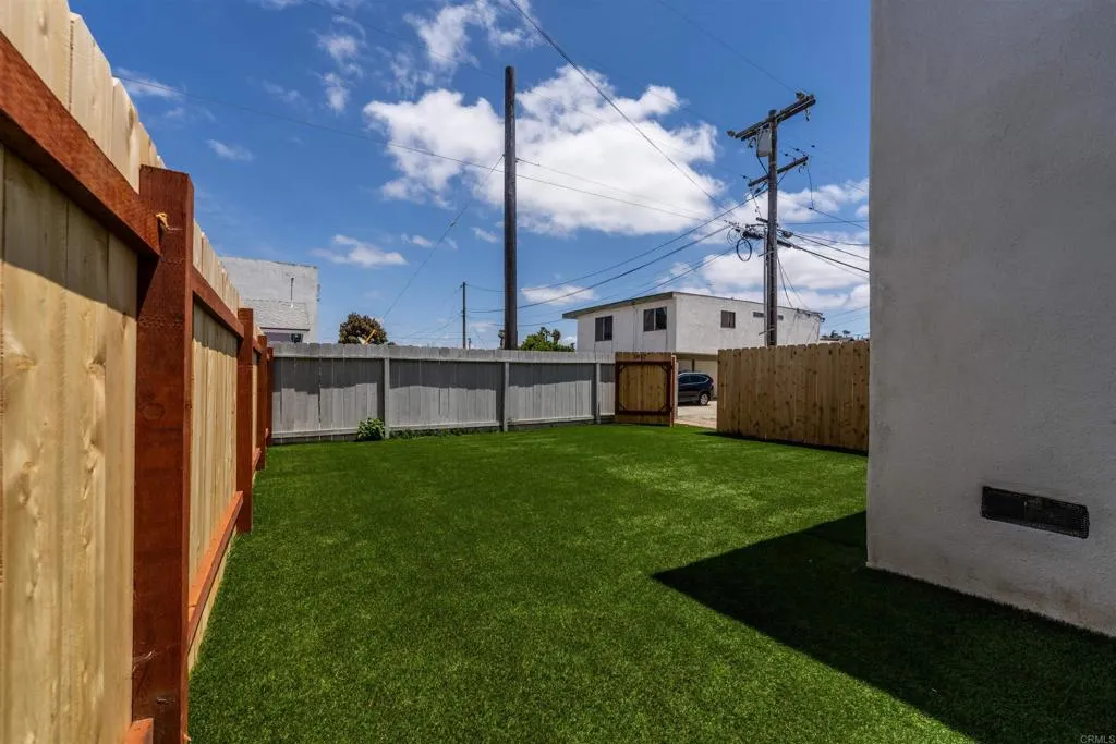 1817 side yard looking toward alley fence