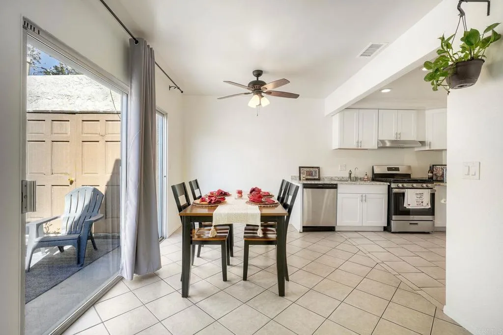 Spacious dining area adjacent to kitchen and open to interior courtyard~