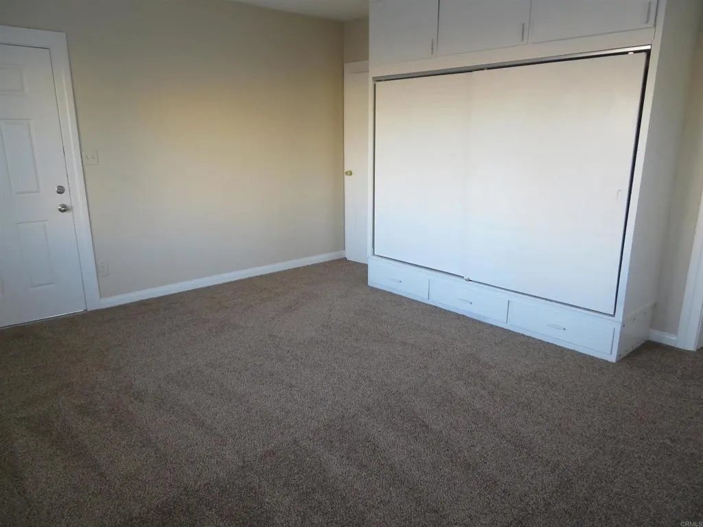 4202 43rd Street, San Diego, CA 92105 spacious primary bedroom with bathroom access