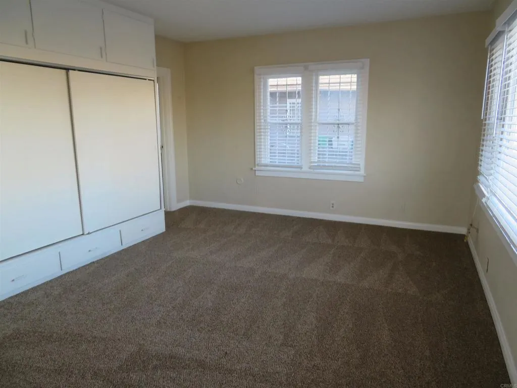 4202 43rd Street, San Diego, CA 92105 spacious primary bedroom with bathroom access