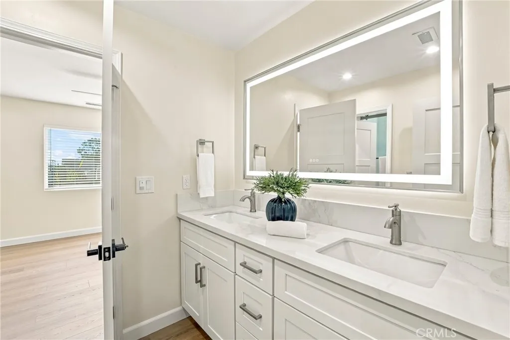 4661 Redwood Street, San Diego, CA 92105 Jack & Jill bathroom between the 2 secondary bedrooms upstairs. Quartz countertops, double vanity, designer details continue throughout the house.