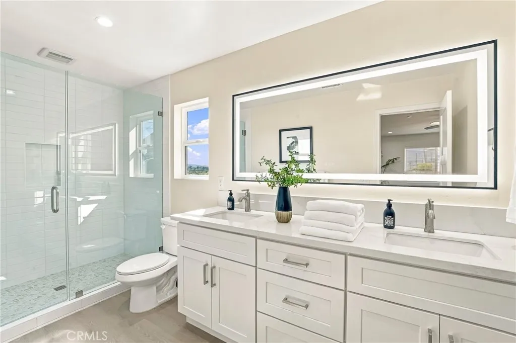 4661 Redwood Street, San Diego, CA 92105 Gorgeous primary bathroom with an amazing walk-in shower, quartz countertops with double vanity sinks and plenty of room.