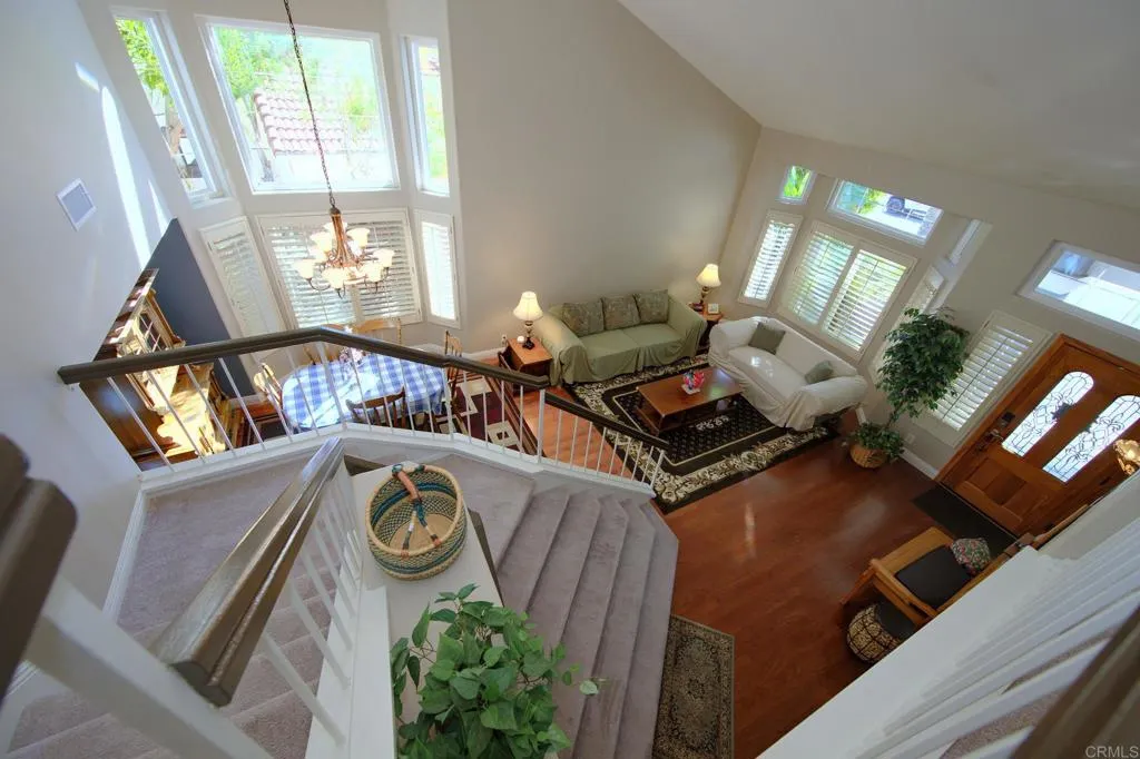 3883 Cornell Dr, Oceanside, CA 92056 Upstairs view to living room and dining room.