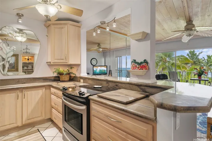 Very functional kitchen with stainless steel appliances and granite counter tops