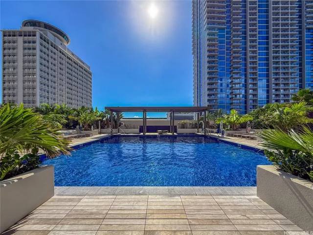 Bring your beverage from the pool bar and soak in the sun on the deck