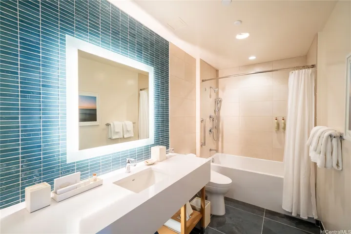 Outside is brought inside with gorgeous hand-made tiles that frame the mirror