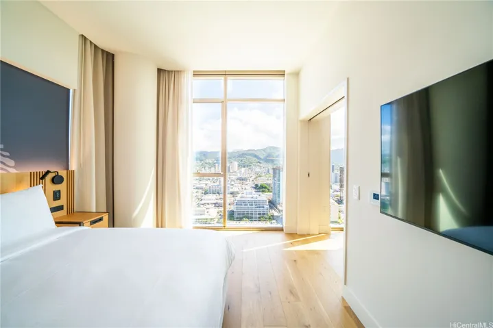 Overlooking the city, the mountains and everlasting sky from your bed