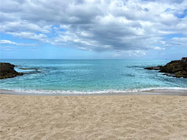 The secluded sandy beach up close