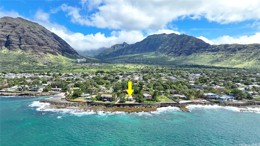 The home is right on the point flanked by beaches and mountains