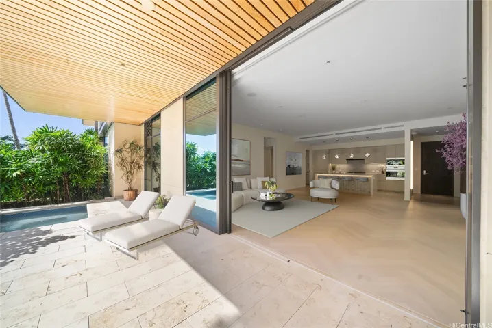 Spacious open living room and lanai, virtually staged