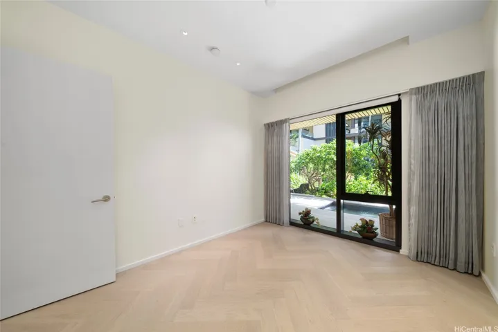 Secondary bedroom with custom walk-in California Closet