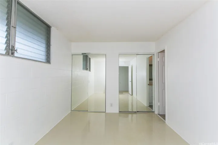 View from Hall door to mirror door closets