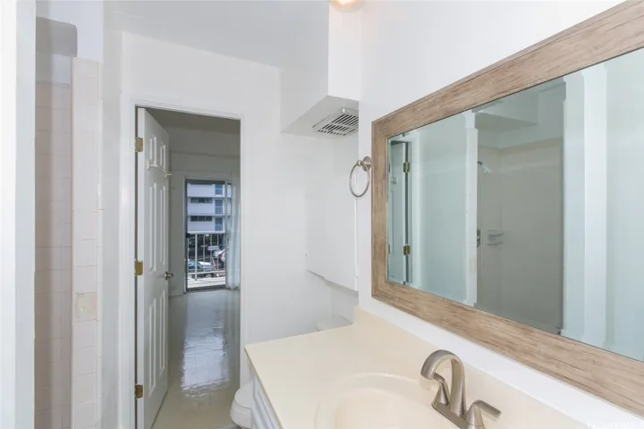 Vanity and mirror to Den and lanai