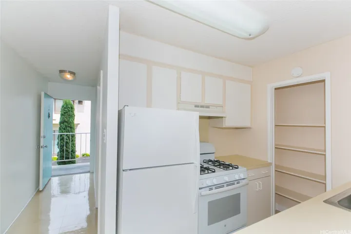 View of kitchen and hall to front door