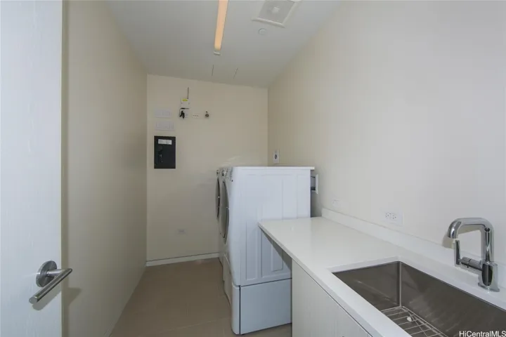 Separate laundry roomwith sink.