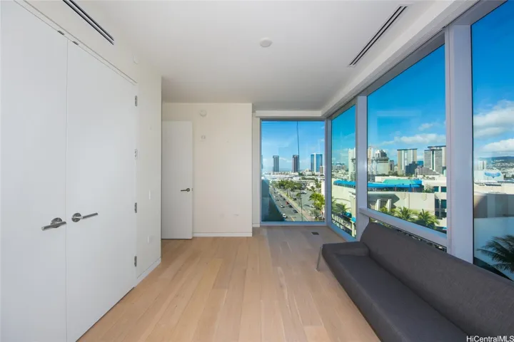 2nd bedroom with wall of glass.
