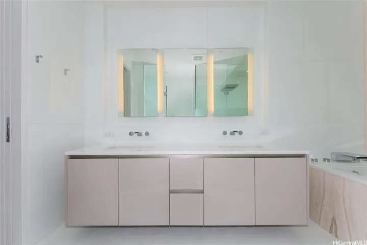 Main bath with large vanity.