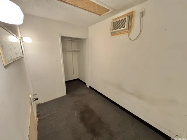 Storage area off of the office with plumbing hookups.
