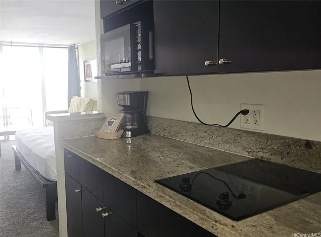 Cooktop, microwave, refigerator, coffee maker
