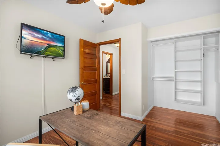 1st Bedroom - multiple uses as a home office, craft room & more. TV screen has been Virtually Enhanced.
