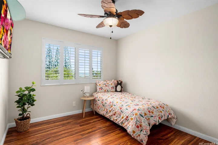 2nd Bedroom. Closet Systems & ceiling fans in all bedrooms. TV screen has been Virtually Enhanced.