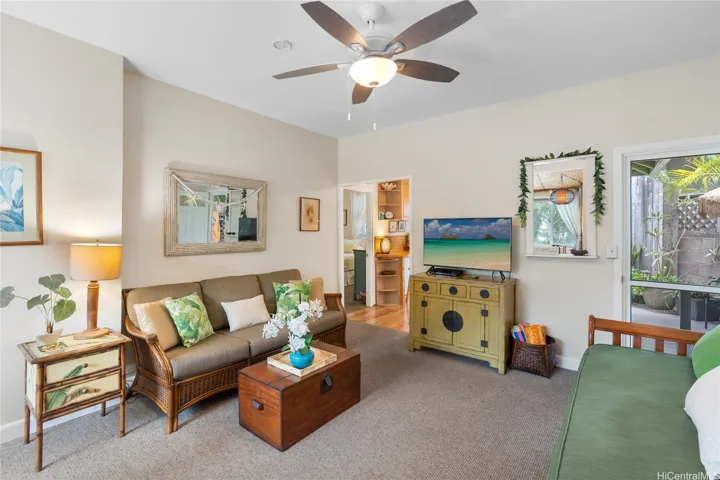 Front bedroom is to the left, entry to second bedroom is visible through the door to the kitchen