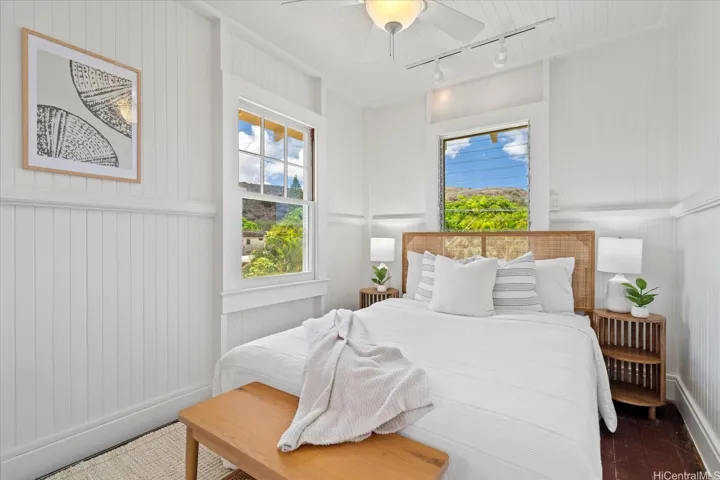 Spacious upstairs bedroom #1 with the original & charming wall+ ceiling wood paneling & trim
