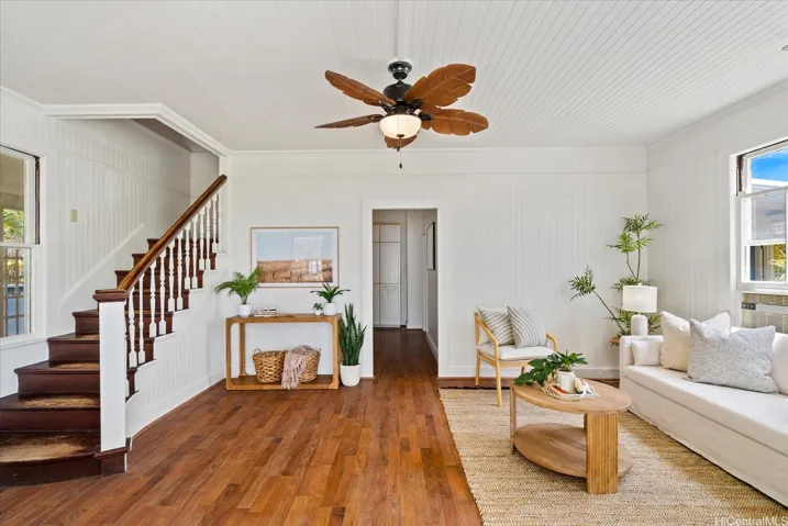Classic and original hardwood staircase leads to 4 bedrooms upstairs