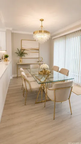 Virtually Staged Dining Area. Chic and sophisticated dining room featuring an elegant crown molding, and modern wide-plank flooring. Flooded with natural light from large sliding glass doors, this space offers the perfect layout for intimate dinners or hosting guests right off the kitchen.