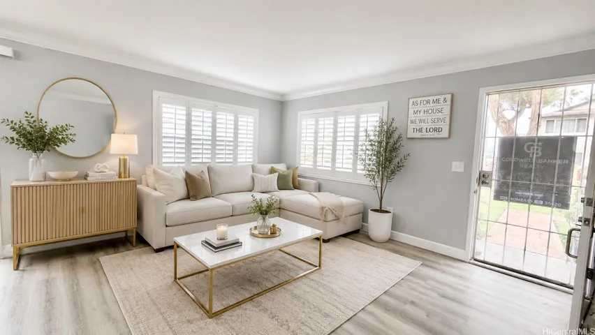 Virtually Staged Living Area.  Bright, airy, and beautifully upgraded living room featuring premium plantation shutters, elegant crown molding, and chic modern flooring. The expansive layout offers a neutral palette, abundant natural light, and the perfect setup for comfortable entertaining or everyday relaxation. Turn-key perfection!