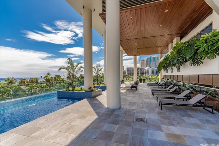 The amenity deck with an infinity pool and a place to relax.