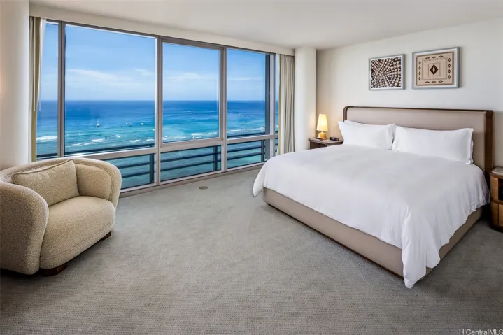 Primary bedroom with an expansive ocean view.