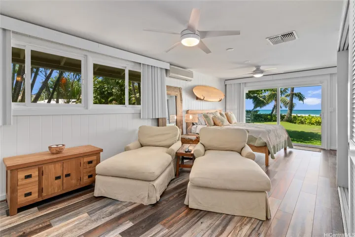The oceanfront main bedroom offers direct yard access and a split AC system for personalized comfort, making it a serene retreat with stunning views right outside your door. North Shore Haleiwa Hawaii.