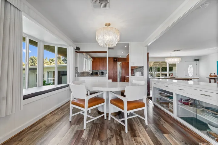 The upgraded ocean-view kitchen features rich wood floors, ample storage, and quality finishes that blend functionality with island elegance. Whether you’re prepping a casual breakfast or entertaining guests, this beautifully designed space offers both comfort and style—with stunning views just beyond the windows. North Shore Haleiwa Hawaii.