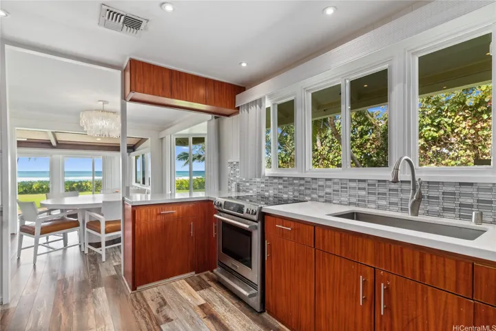 You’ll love the well-appointed ocean-view kitchen, where style meets function and every culinary moment comes with a breathtaking backdrop. Thoughtfully designed for both casual meals and gourmet cooking, it’s a space that inspires. North Shore Haleiwa Hawaii.