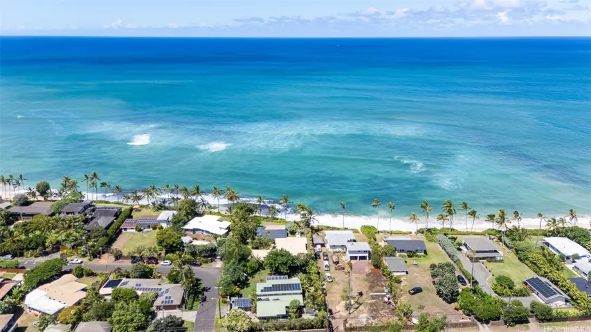 A large natural reef outcropping sits just offshore, helping to buffer the property from strong surf and coastal erosion. For much of the year, shifting sands cover the reef, creating an expansive sandy beachfront that changes with the seasons—offering both beauty and a measure of natural protection. North Shore Haleiwa Hawaii.