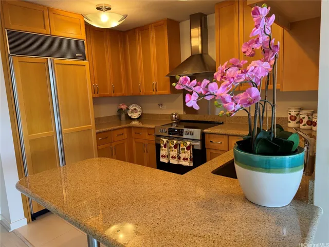 Kitchen showing refrigerator and stove.