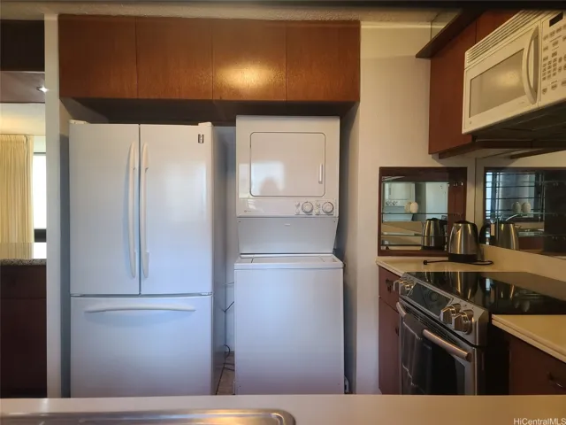 functional kitchen with washer and dryer