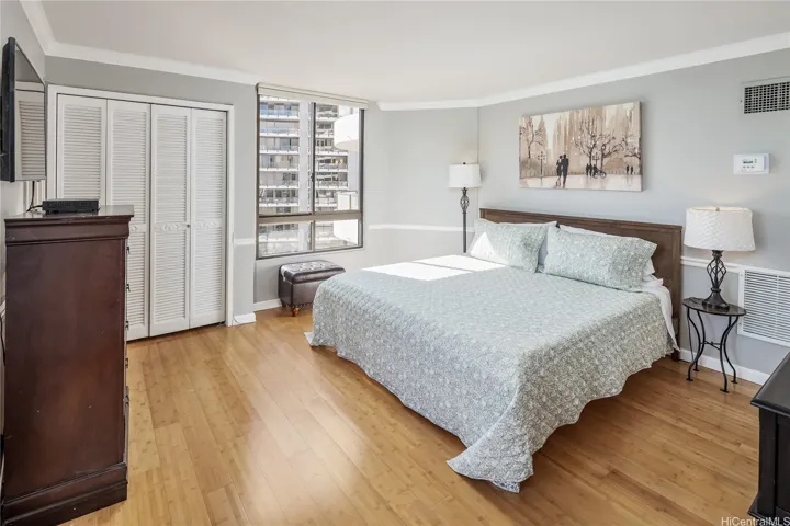 Large primary bedroom with multiple closets